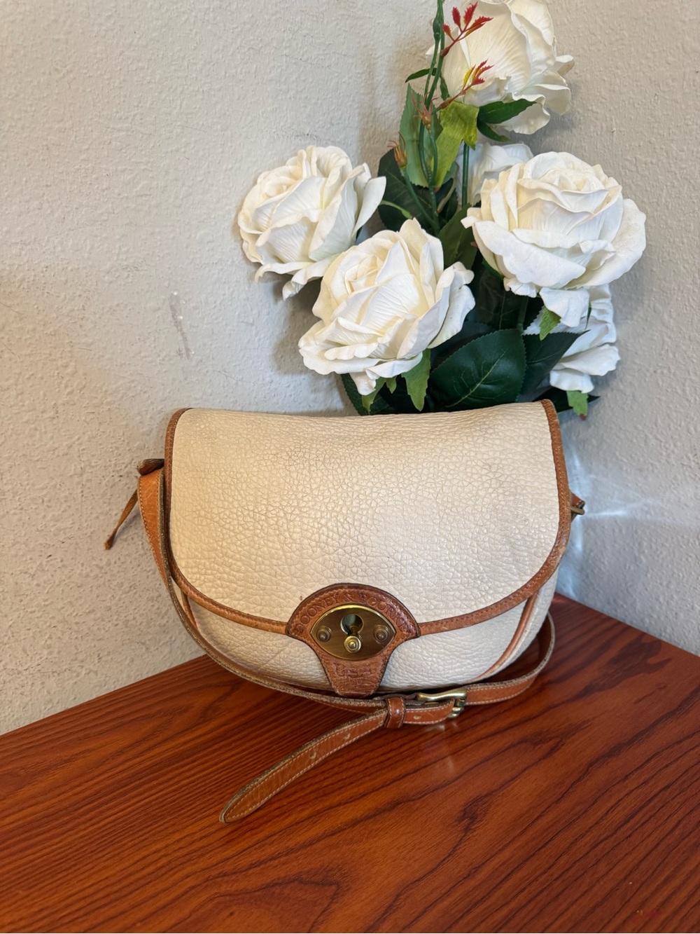 Dooney & Bourke Cream and Brown Pebbled Leather Saddle Crossbody